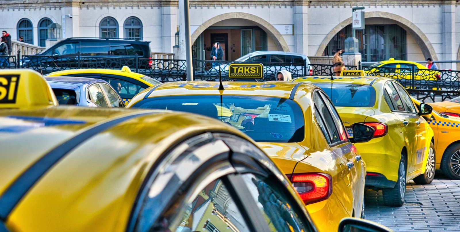 View of Istanbul traffic with taxis, illustrating travel challenges.