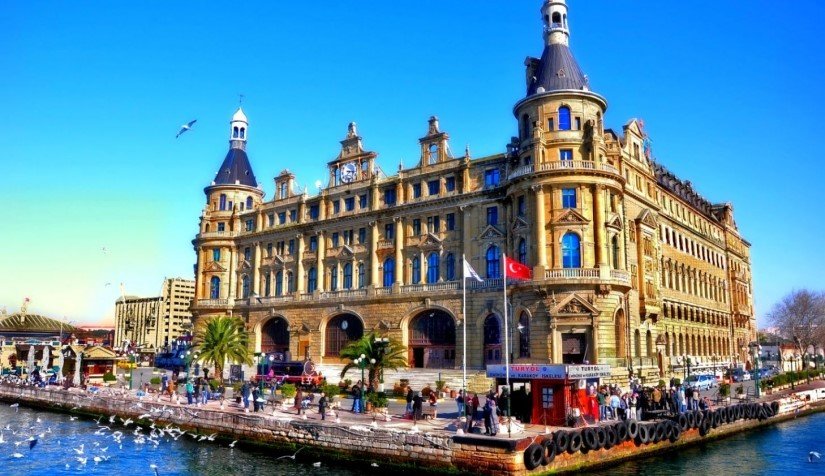 Wide and lively view of Kadikoy's waterfront with ferries and the Bosphorus