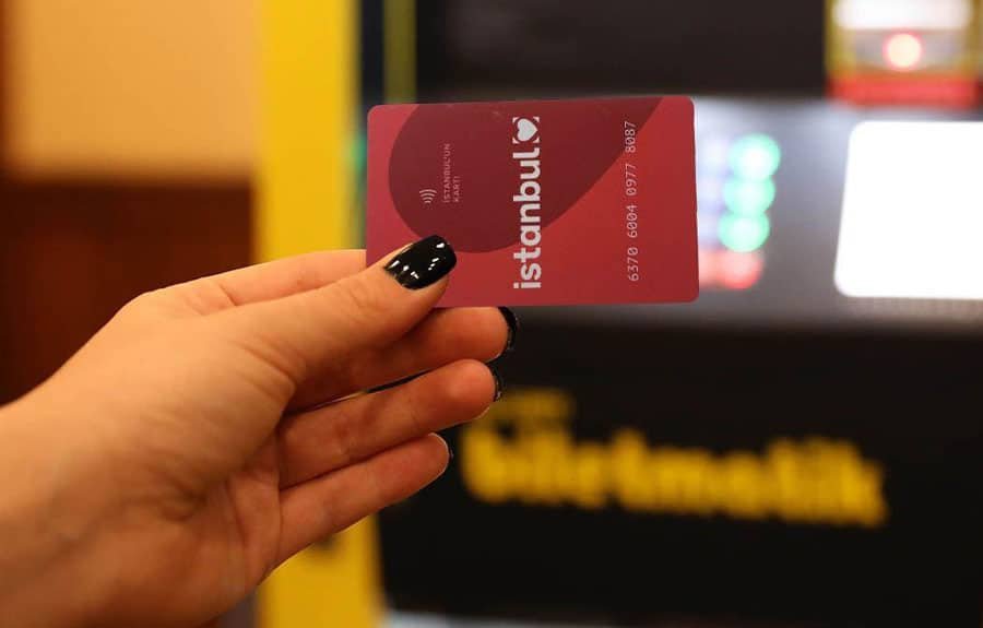 Photo of the Istanbul Card held in front of a tram or ferry in Istanbul