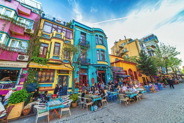 A quiet, tree-lined street in Cihangir with terrace cafes and an intellectual atmosphere.