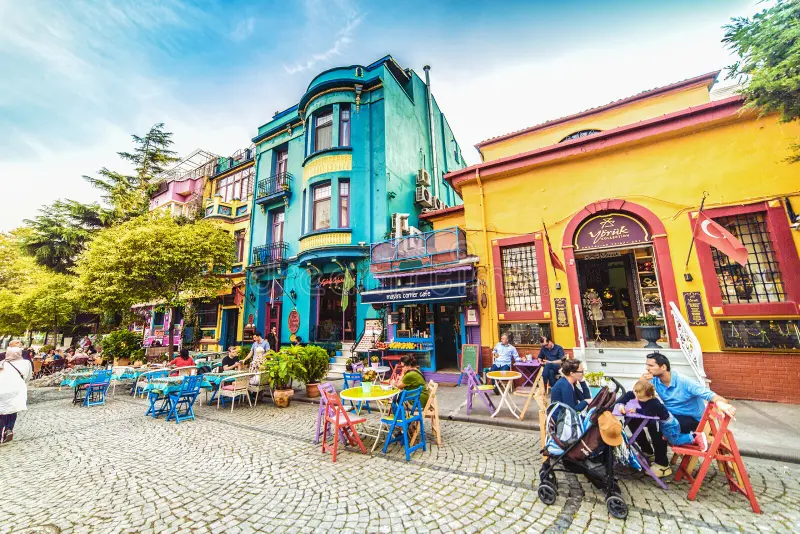 Ambiance of a vintage cafe in Balat with unique decoration, or people strolling through one of the colorful streets.
